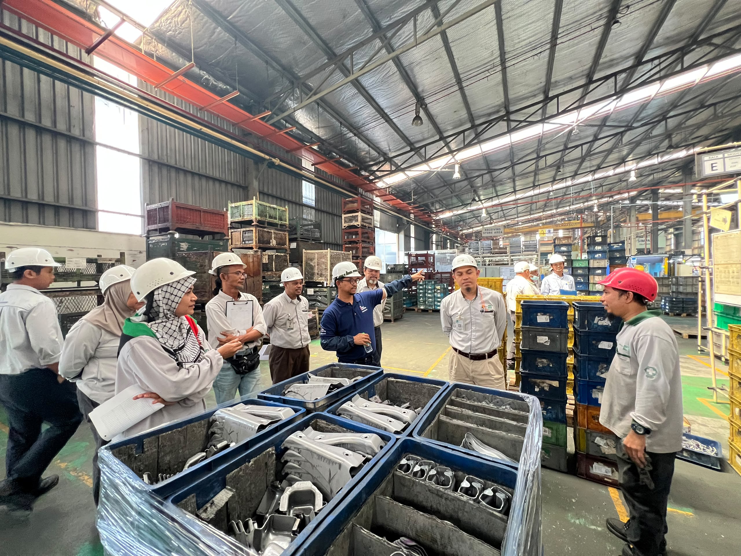 Pesaka Nuri team shop-floor coaching discussion during RCA consulting
