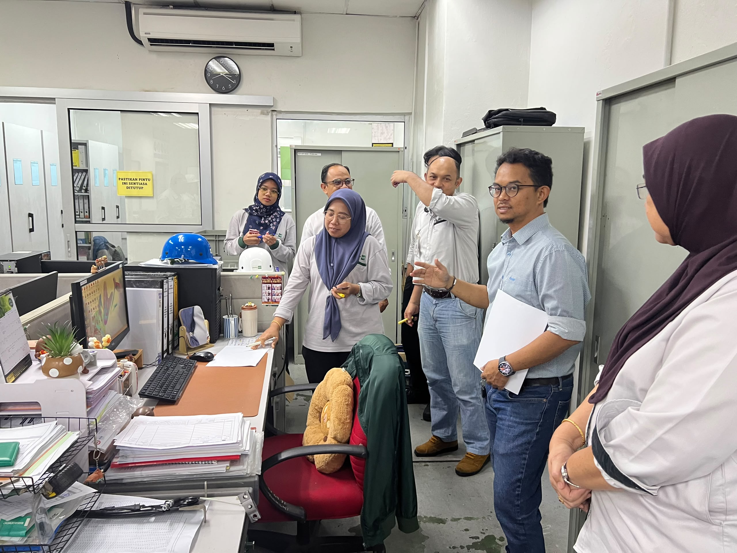 Pesaka Nuri officers reviewing workplace conditions during consulting work