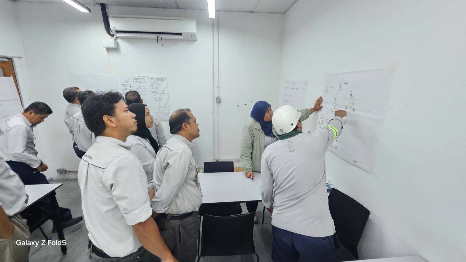 Pesaka Nuri team presenting training notes on the wall