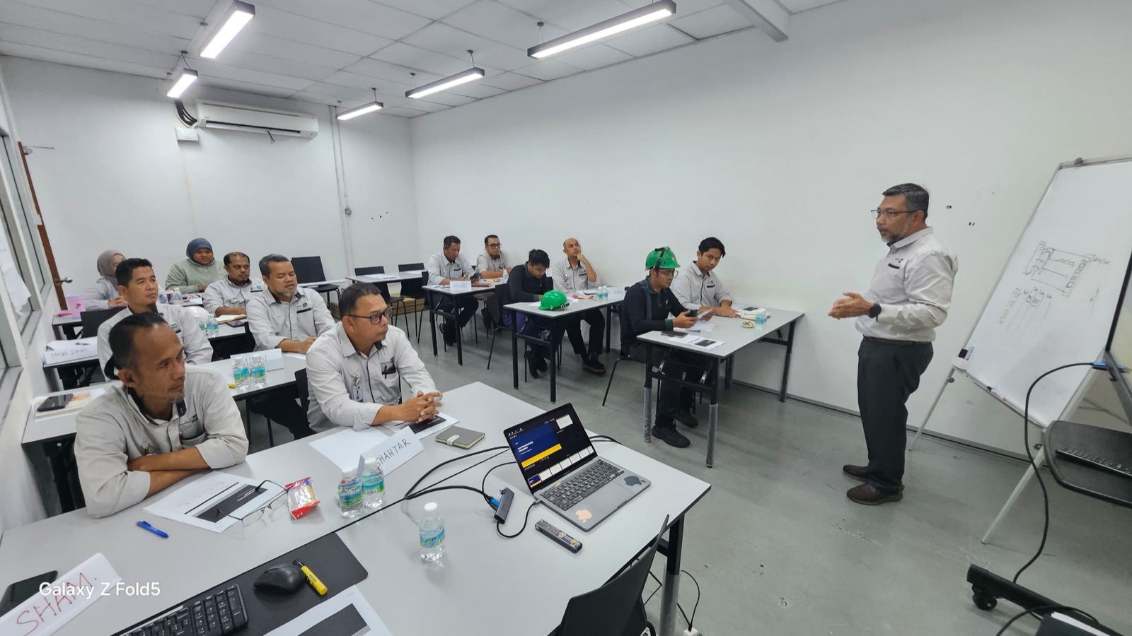 Trainer facilitating a Pesaka Nuri classroom session