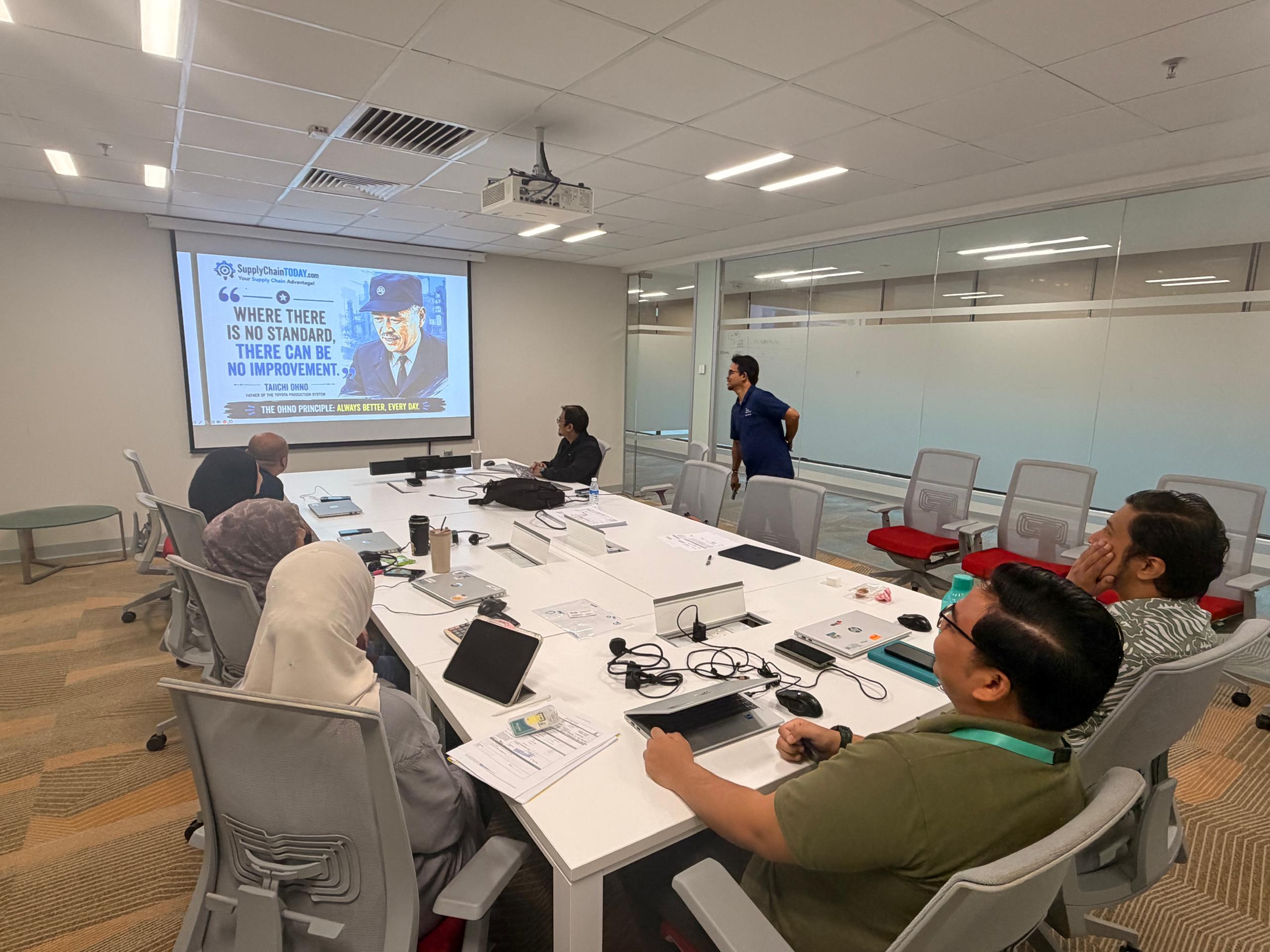 Petronas Kaizen Principles training slide on standardisation and improvement