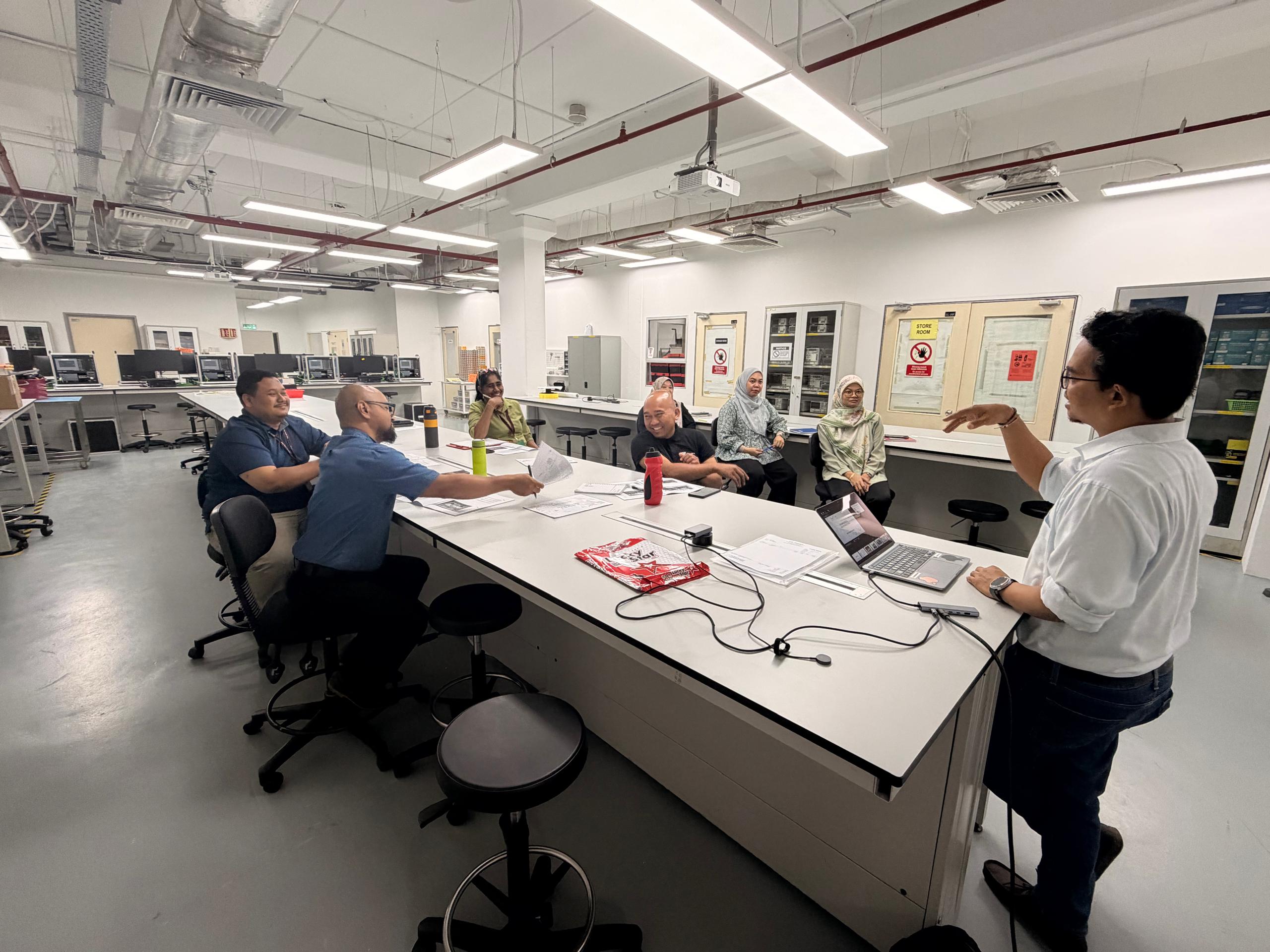 Taylor's University engineering lab participants discussing 5S practical activities