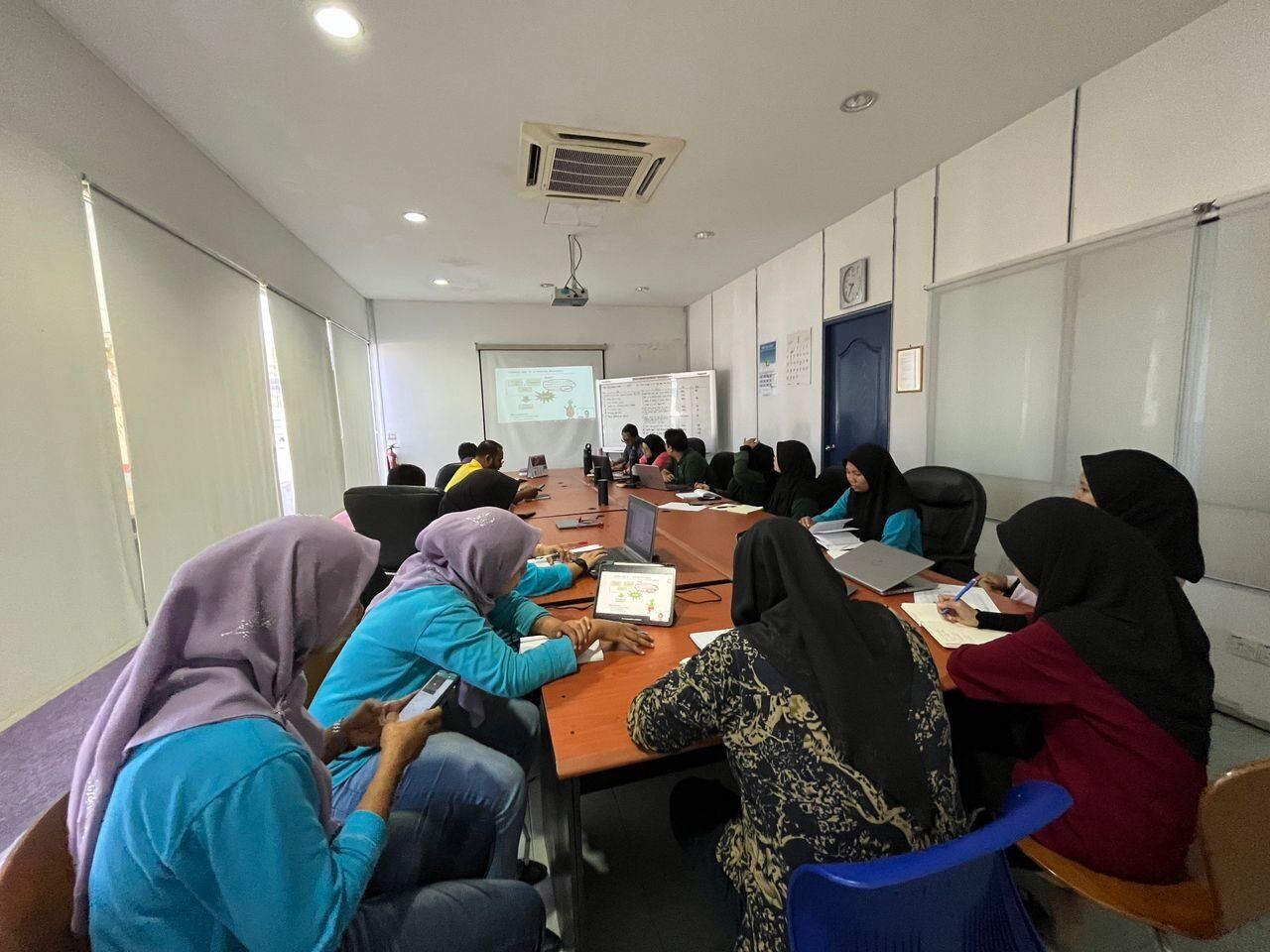 Manufacturing training participants working on practical classroom exercises