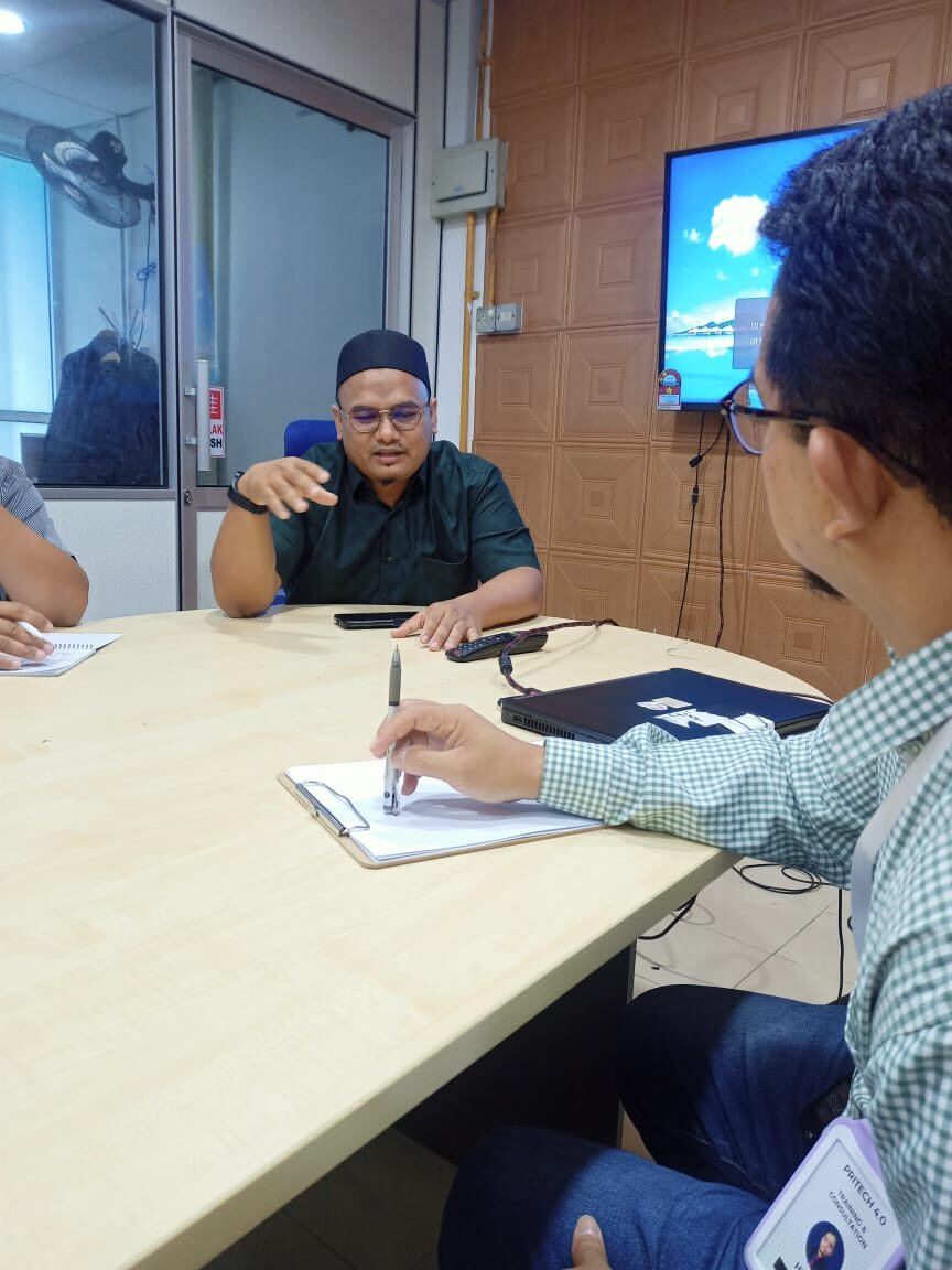 Consulting interview session with manufacturing team members