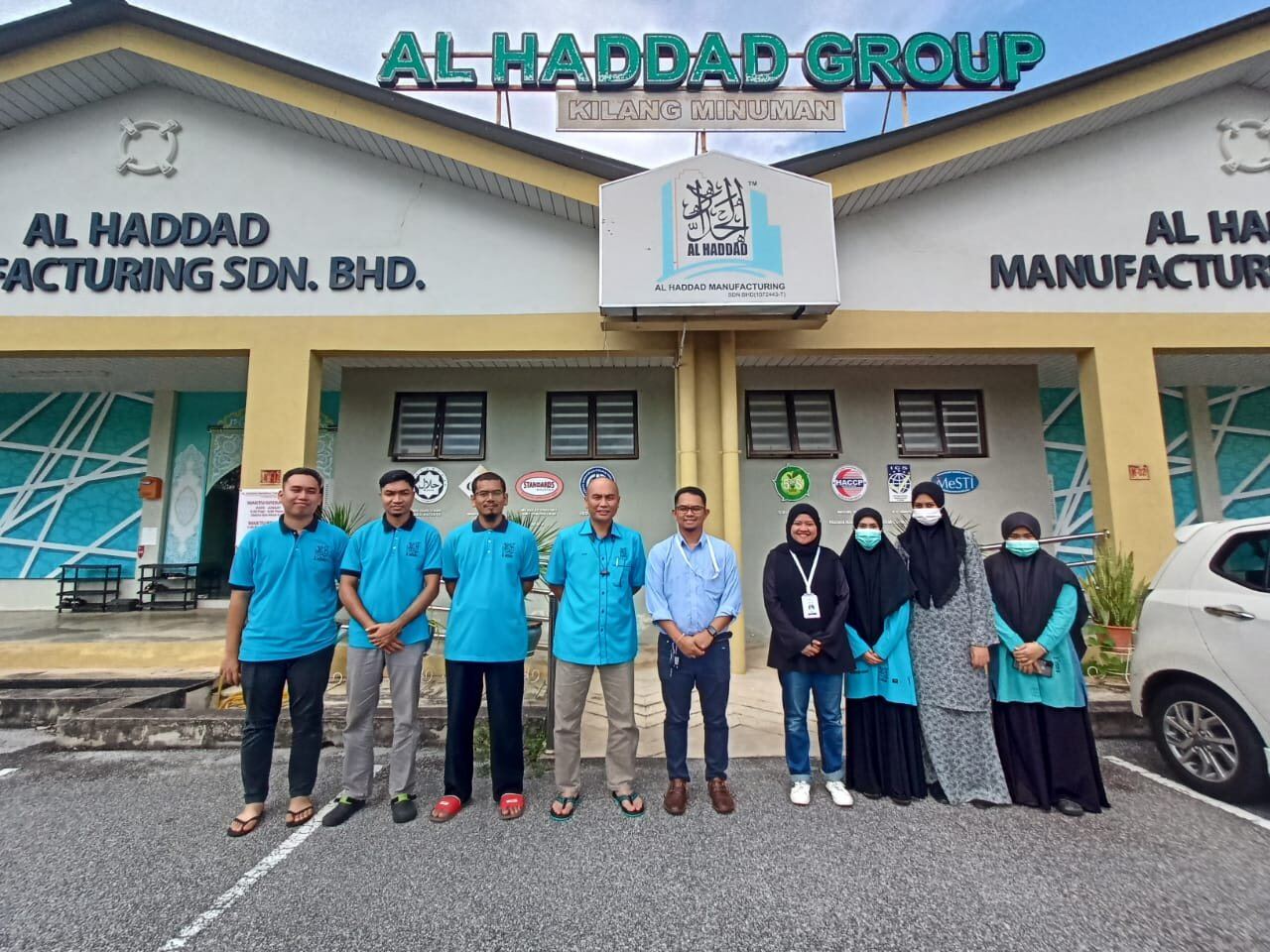 Group photo with a Malaysian manufacturing team after a consulting or training engagement
