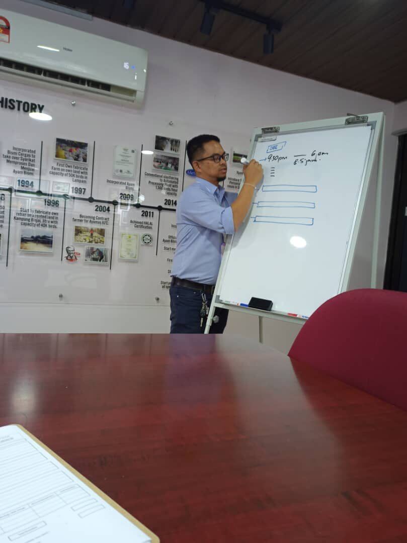 Whiteboard training session for manufacturing improvement participants